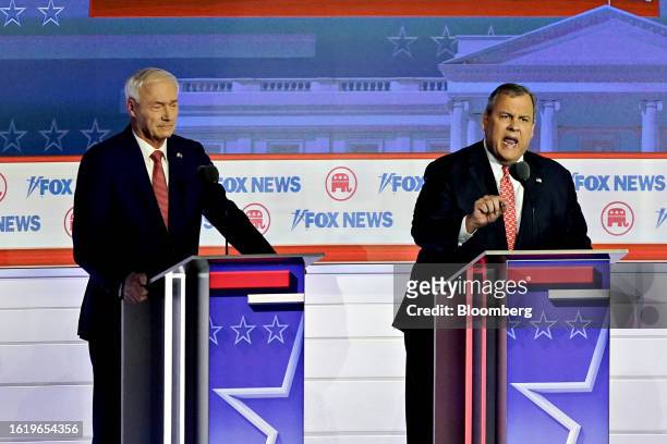 Chris Christie, former governor of New Jersey and 2024 Republican presidential candidate, right, and Asa Hutchinson, former governor of Arkansas and...