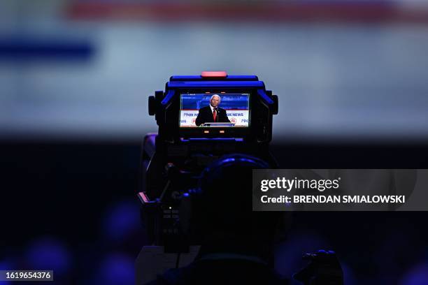 Former US Vice President Mike Pence is seen on the screen of a camera during the first Republican Presidential primary debate at the Fiserv Forum in...