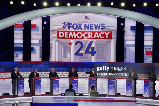 Republican presidential candidates Asa Hutchinson, from left, Chris Christie, former Vice President Mike Pence, Ron DeSantis, Vivek Ramaswamy, Nikki...