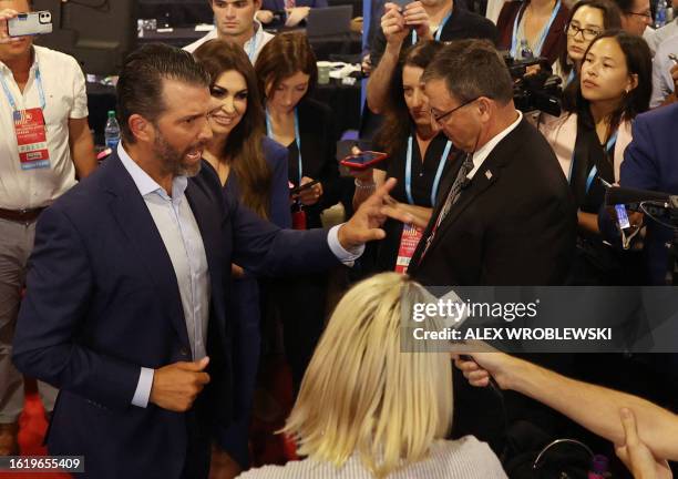 Donal Trump Jr. Speaks to reporters after being blocked from going into the Spin Room by security personnel following the first Republican...
