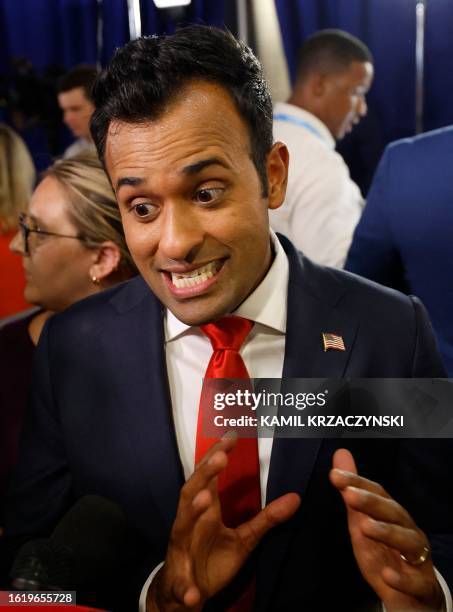 Entrepreneur and author Vivek Ramaswamy speaks to a reporter in the Spin Room following the first Republican Presidential primary debate at the...