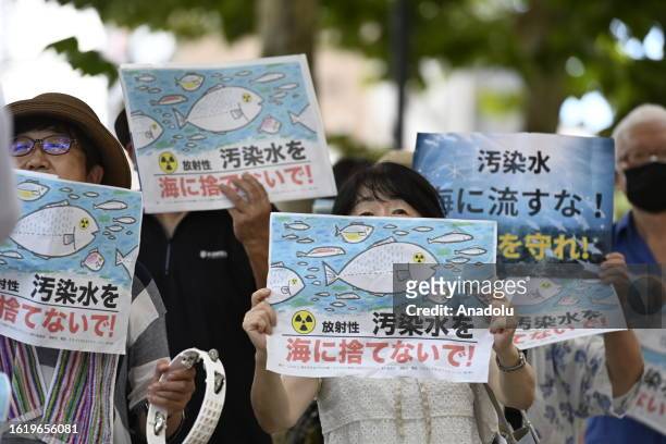 People gather to protest in front of TEPCO, Tokyo Electric Power Company, on August 24 in Tokyo, Japan, as Japan starts to release at sea 7,800 tons...