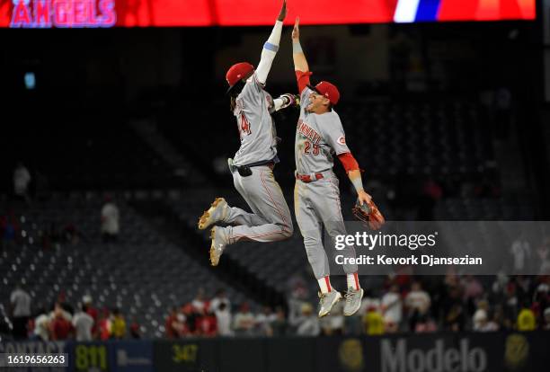 Elly De La Cruz and TJ Friedl of the Cincinnati Reds celebrate after defeating the Los Angeles Angels 7-3 in game two of a doubleheader to sweep the...