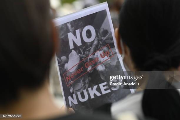 People gather to protest in front of TEPCO, Tokyo Electric Power Company, on August 24 in Tokyo, Japan, as Japan starts to release at sea 7,800 tons...