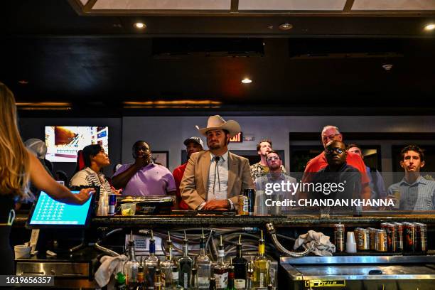 Members of the Atlanta Young Republicans attend a watch party of the first Republican Presidential primary debate at a bar in Atlanta, Georgia on...