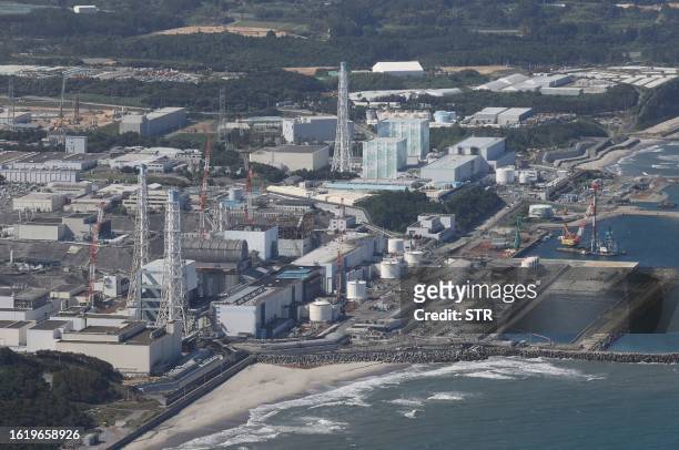 This aerial picture shows TEPCO's crippled Fukushima Daiichi Nuclear Power Plant in Okuma, Fukushima prefecture on August 24, 2023. Japan began...