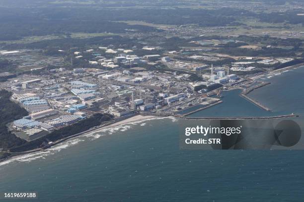 This aerial picture shows storage tanks used for storing treated water at TEPCO's crippled Fukushima Daiichi Nuclear Power Plant in Okuma, Fukushima...