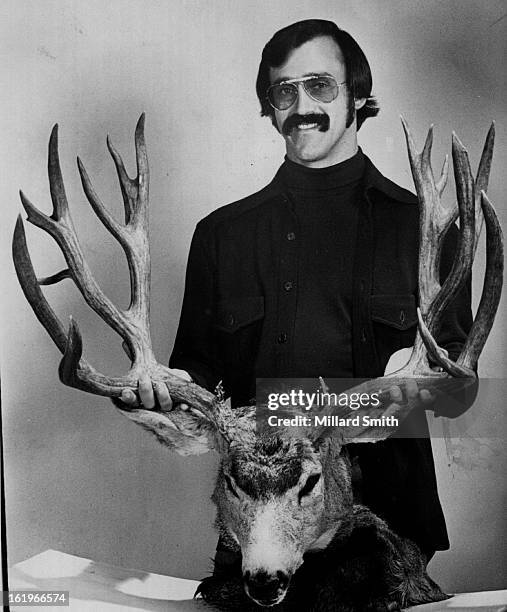 Hunting - Animals; They Grow Big at Timberline; Robert R. Ross, 1390 Everett Court, Lakewood, holds rack of buck mule deer he killed near timberline...