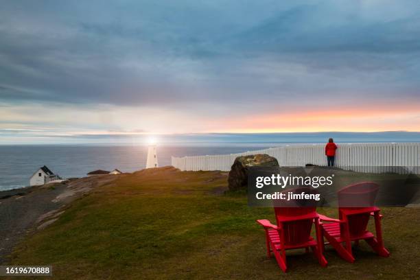 national park walking tour at cape spear lighthouse national historic site, newfoundland and labrador, canada - st john's red storm stock pictures, royalty-free photos & images