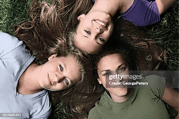 stockillustraties, clipart, cartoons en iconen met three best friends lying on backs looking up at camera - light skin black woman