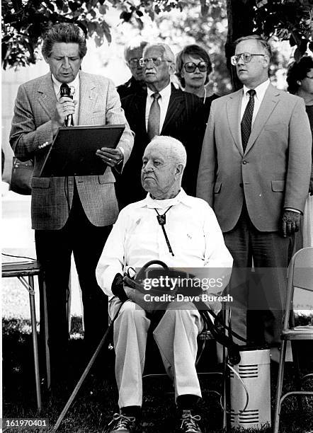 Thomas Hornsby Ferril 91 year old poet laurate sits in the foreground as Deputy Mayor John Mroqek on the left acting for Mayor Pena is reading the...