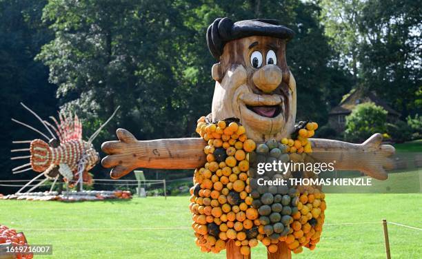 Character depicting Fred Flintstone is seen at a pumpkin exhibition in the garden of Ludwigsburg Castle in Ludwigsburg, southern Germany, on August...