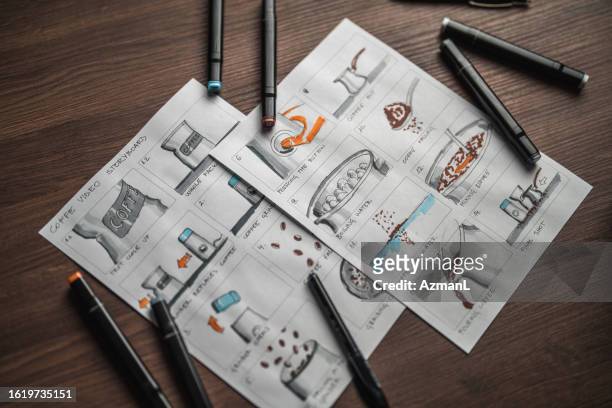 storyboard and colored pencils on the table - storyboard cinema stock pictures, royalty-free photos & images