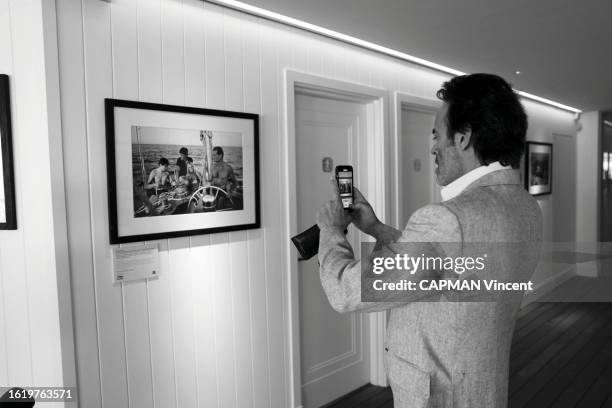 Opening of the Alain Delon exhibition at Cap Eden Roc Hotel . Anthony Delon and Philippe Perd the Ceo of the Hotel are photographed for Paris Match...