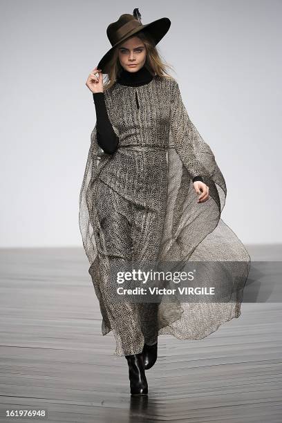 Cara Delevingne walks the runway during the Issa Ready to Wear Fall/Winter 2013-2014 show as part of the London Fashion Week Fall/Winter 2013/14 at...