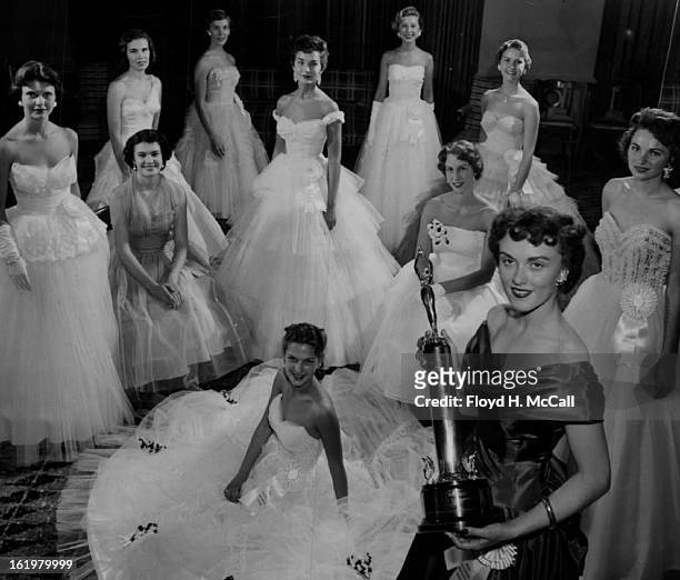 Miss Colorado candidates, arrayed in stately finery for their meeting with press photographers at the Cosmopolitan hotel, warm up their smiles for...