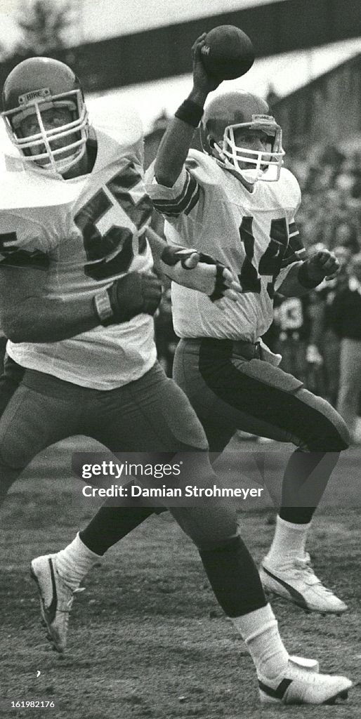 MAR 6 1983, MAR 7 1983; Quarterback Chuck Fusina holds the ball aloft while enroute to the Stars' fi