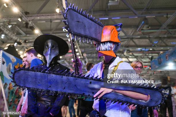 Photo shows cosplayers at the Gamescom video game fair in Cologne, western Germany on August 24, 2023. According to the organisers, around 1,100...