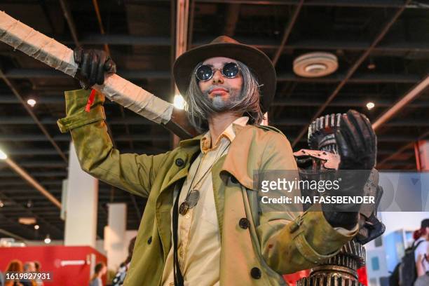 Photo shows a cosplayer at the Gamescom video game fair in Cologne, western Germany on August 24, 2023. According to the organisers, around 1,100...