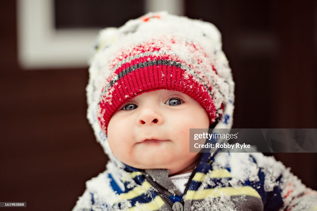 Baby With Blue Eyes Wearing A Hat