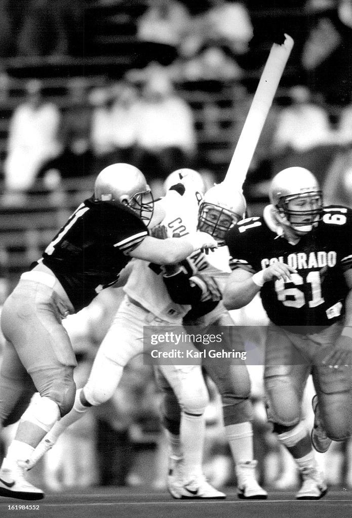 MAY 3 1987; Colorado University Athletics Football; CU alumnus #49 Ray cone took a hit during the fi