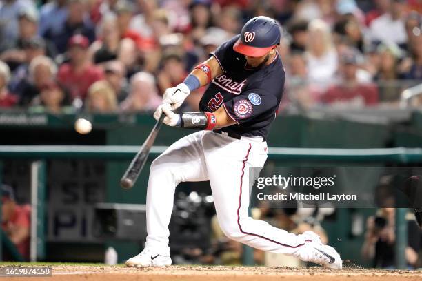 Keibert Ruiz of the Washington Nationals hits a three-run home run in the eight inning against the Boston Red Sox at Nationals Park on August 16,...