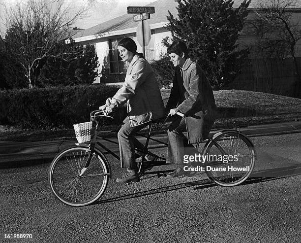 Karen Koelling, Right, and Genevieve Hammond, A Neighbor, Ride Tandem Bicycle; Miss Koelling, who is blind, has completed requirements for graduation...