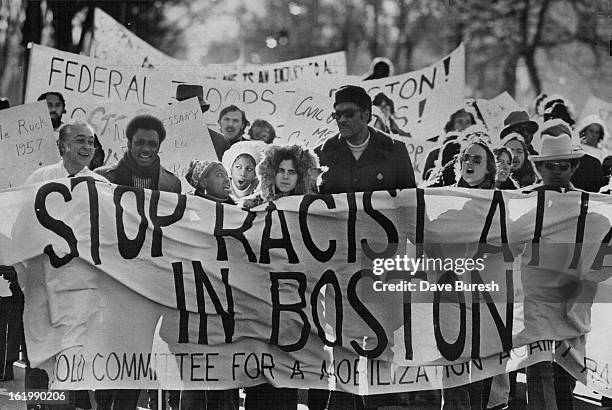 Marchers Support National March; Marchers hold a huge banner as they lead the way for about 120 per- ions who walked from East High School, 1545...