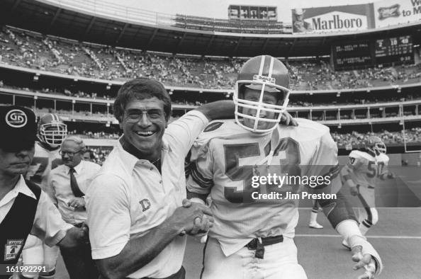 Danzi Reeves SEP 5 1983; A happy Dan Reeves gives a handshake and a hug to... News ...