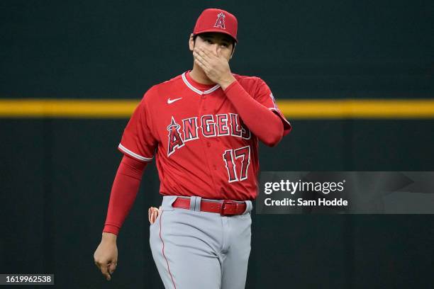 Shohei Ohtani of the Los Angeles Angels walks on the field before the game against the Texas Rangers at Globe Life Field on August 16, 2023 in...