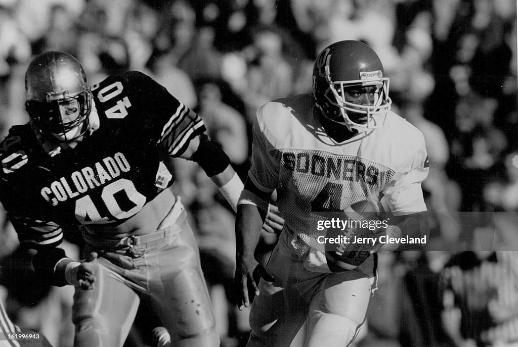 11/15/1986, NOV 16 1986; Colorado University Athletics Football; Oklahoma QB Jamelle Holieway is pur