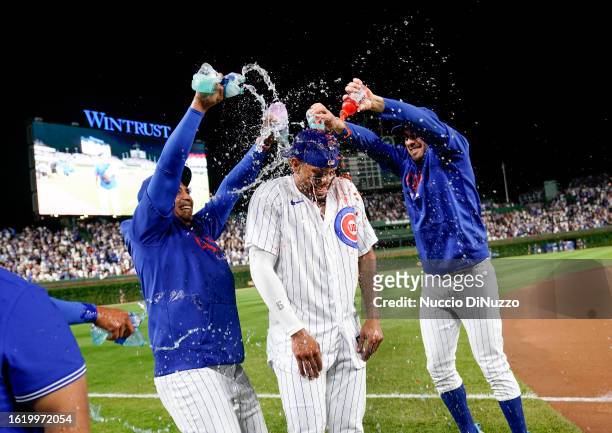 Christopher Morel of the Chicago Cubs is doused with Gatorade following a walk-off three-run home run against the Chicago White Sox at Wrigley Field...