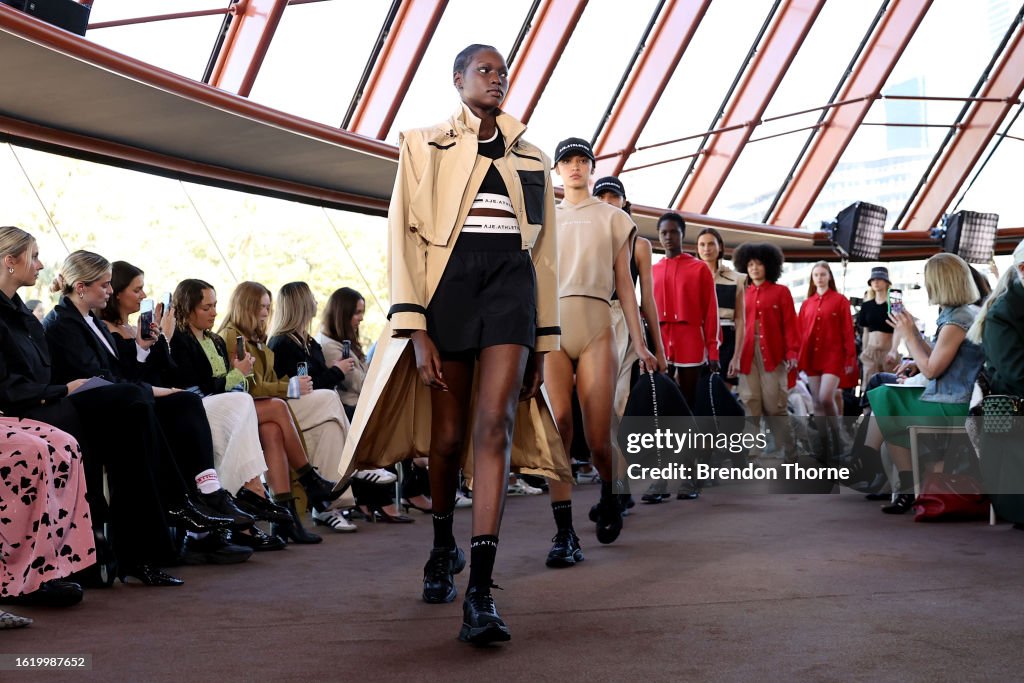Models showcase designs during the Aje Athletica runway