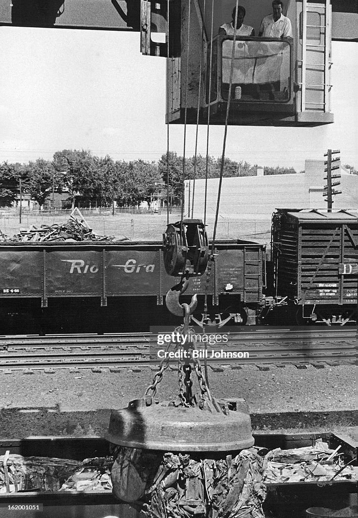 JUL 7 1966, JUL 13 1966; The finished products are lifted into gondola railroad cars by the overhead