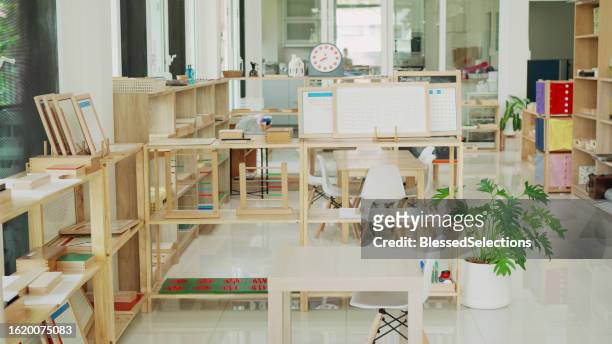 a montessori classroom set-up, montessori homeschooling education - draft first round stock pictures, royalty-free photos & images