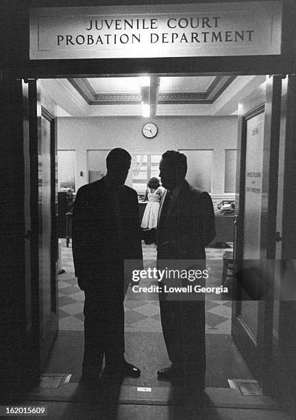 Probation Officer Kirk Hills and Gilliam at door of juvenile probation department. Youngsters can earn probation in 90 days on work crew, if they do...