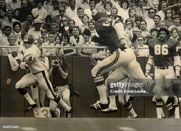 Setting Sights For A Foot Race; Floyd Little of the Denver Broncos looks back at Emmitt Thomas of Kansas City on the way to a 50-yard touchdown run...