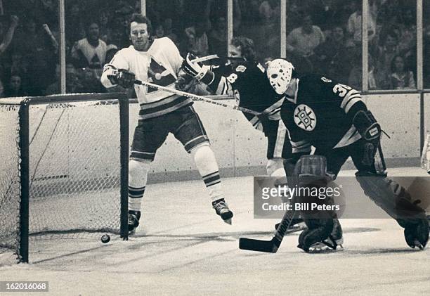 Ice Hockey Colorado Rockies ; Rockies Shooter Out of Picture, but Puck's in Net; Boston's Jim Craig and Dick Redmond watch with Rockies' Walt...