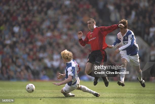 Eric Cantona of Manchester United leaps above Colin Hendry of Blackburn Rovers during the FA Premier League match at Ewood Park in Blackburn,...