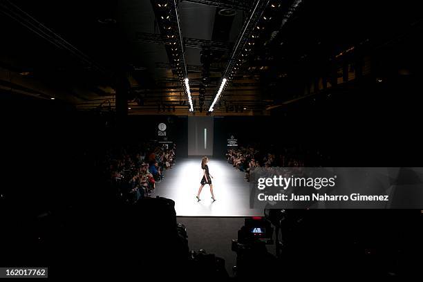 Model showcases designs by Teresa Helbig on the runway at the Teresa Helbig show during Mercedes Benz Fashion Week Madrid Fall/Winter 2013/14 at...