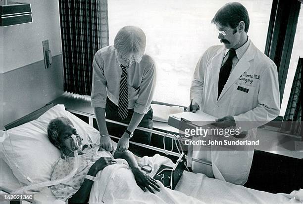 Evaluating The Nutritional Status of A Trauma Patient; Nurse Todd Jones, top, checks nutritional status of patient Dorothy Byrd by measuring...