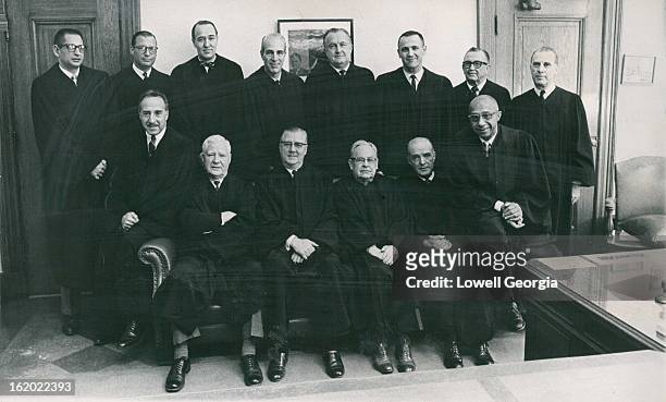 Thirteen of the 14 Judges of the Denver District Court; Front row, left to right, are Mitchel B. Johns, Neil Horan, Gerald E. McAuliffe, Robert W....