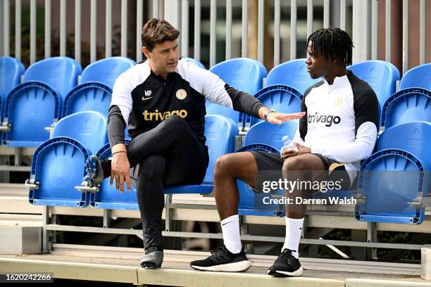 Head Coach Mauricio Pochettino and Romeo Lavia of Chelsea during a training session at the Chelsea Training Ground on August 24, 2023 in Cobham,...