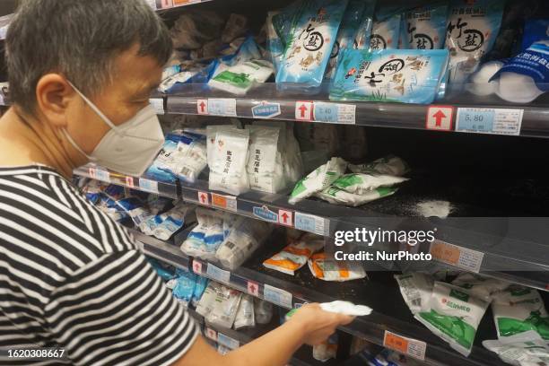 Citizens buy salt at a supermarket in Hangzhou, Zhejiang province, China, August 24, 2023. On the same day, Japan started to discharge contaminated...