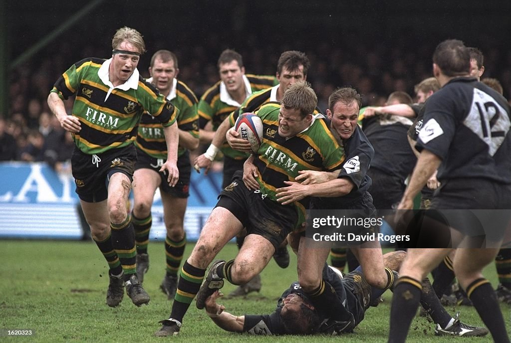 David Merlin Rugby Dave Merlin of Northampton is tackled by Alex King of Wasps during ...