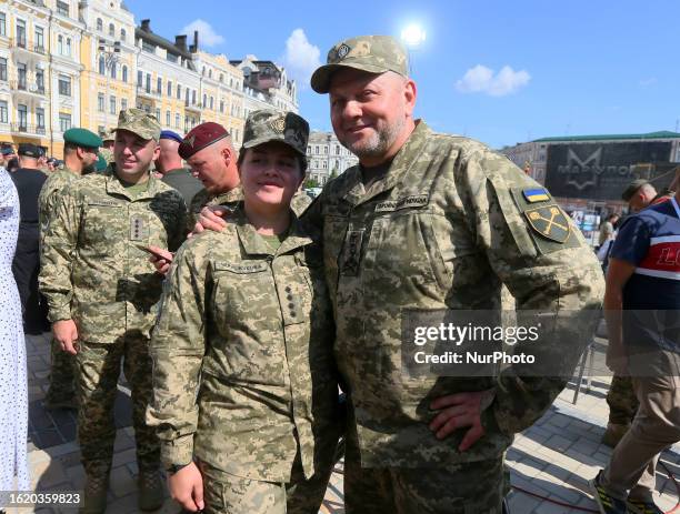 Commander in Chief of the Ukrainian Armed Forces Valerii Zaluzhnyi poses for a photo with a female soldier during a celebration ceremony of the...