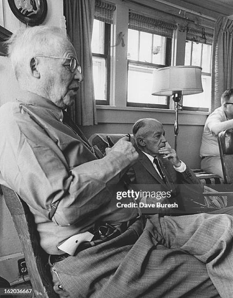 Fred Hesse, Buffalo, Wyo., at left, and Pax Irvine, formerly of Lusk, Wyo., sit room of Sun Ranch during get-together of Johnson county cattle war...