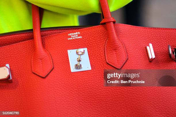 Fashion marketing student Sharon poses wearing an outfit by Brian Lichtenberg with a Hermes bag at Somerset House during London Fashion Week on...