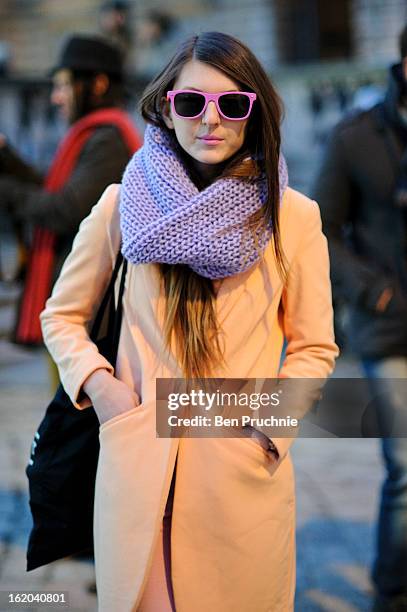 Blogger Magdalena Wieclaw poses wearing an outfit from H+M with jeans and glasses from Primark at Somerset House during London Fashion Week F/W 2013...