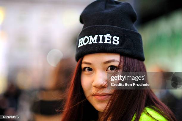 Fashion marketing student Sharon poses wearing an outfit by Brian Lichtenberg with a Hermes bag at Somerset House during London Fashion Week on...